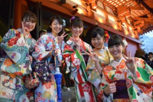 five women wearing oriental dresses